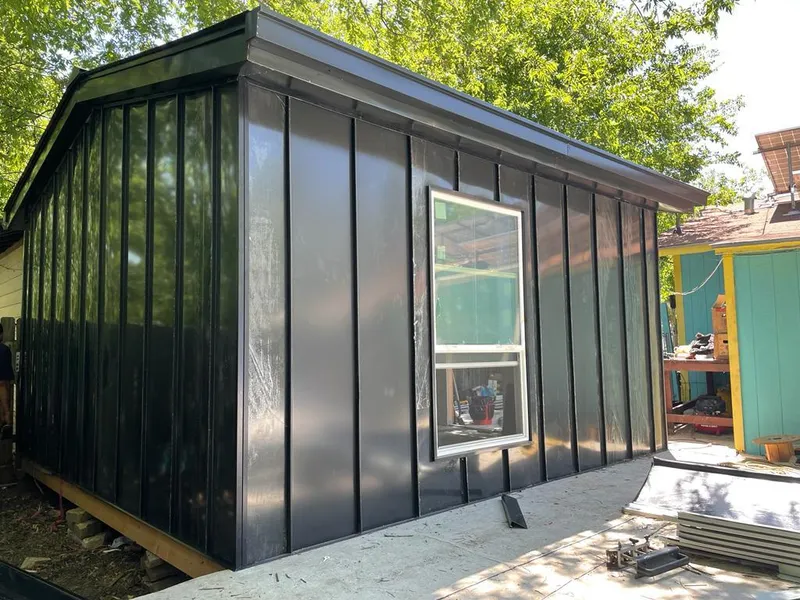 Black standing seam metal wall panels for Metal Roof Installation in Mehlville