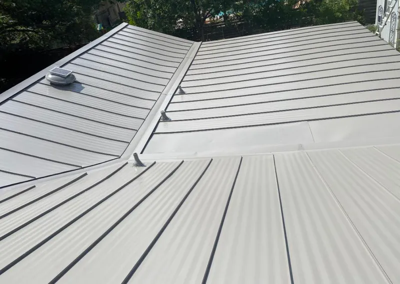 Solar attic fan installed on a metal roof for Roof Ventilation in Mehlville